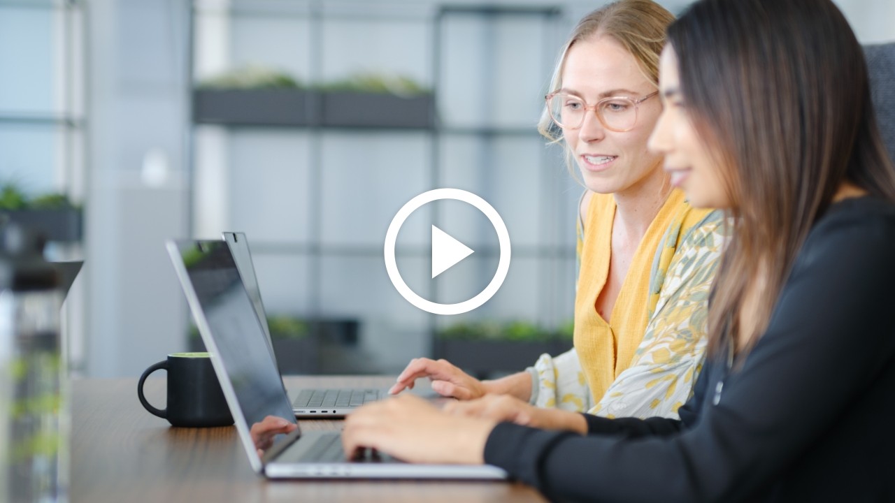 individual using a workstation to do compute intensive work on multiple monitors.