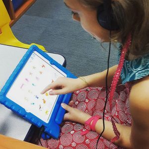 scratchjr app teaching a young student how to code
